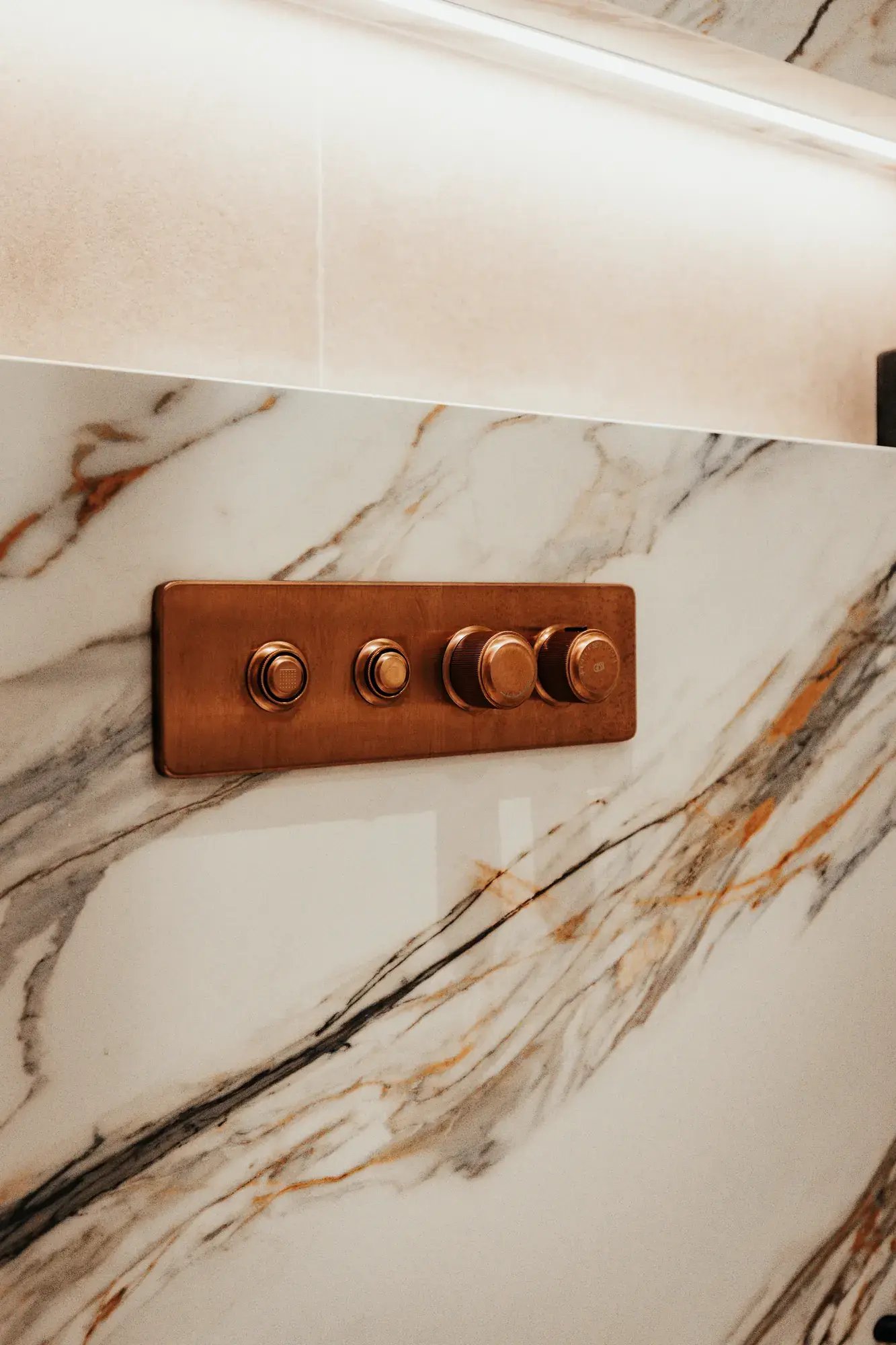 kallums-luminous-heaven-london-bathroom-copper-thermostatic-shower-control-marble-tile