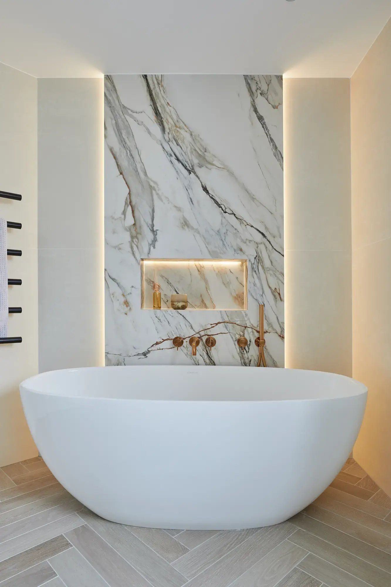 kallums-west-london-bathroom-freestanding-bath-marble-feature-wall-portrait