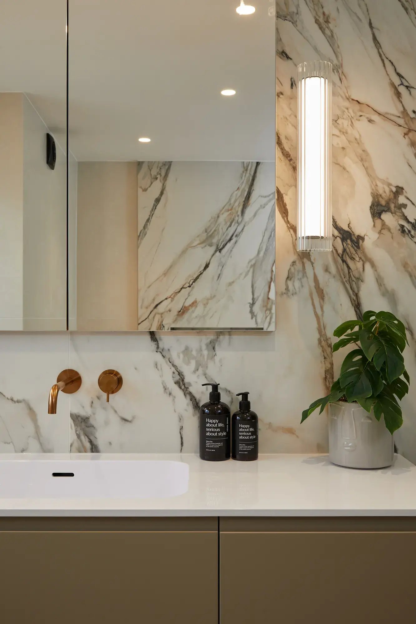 kallums-west-london-bathroom-wall-light-basin-copper-tap-portrait