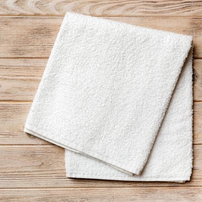 top-view-of-white-towels-with-copy-space-on-colore-2025-03-10-09-41-15-utc