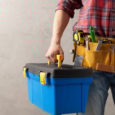 worker-man-holding-construction-toolbox-near-concr-2024-10-17-23-56-23-utc-1