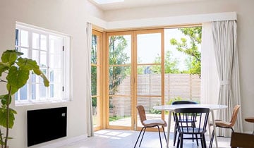 Glass panel heater in garden room